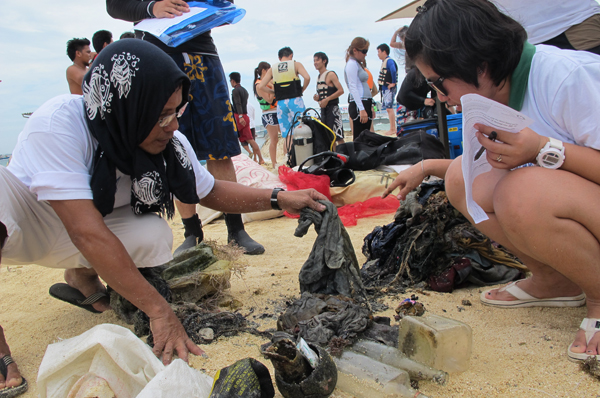 Sorting through the thrash recovered by the team members of the underwater cleanup