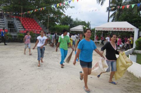 Representatives from nearby barangays came with their brooms and sacks
